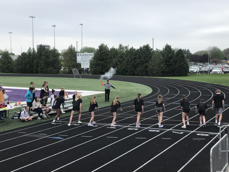 Runners at the starting line of a track race